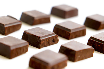 A pile of milk chocolate slab blocks broken up and stacked