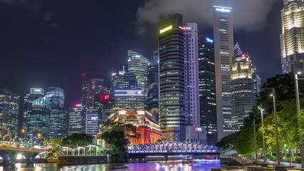 Fototapeta na wymiar Business Financial Downtown City and Skyscrapers Tower Building at Marina Bay night timelapse hyperlapse, Singapore