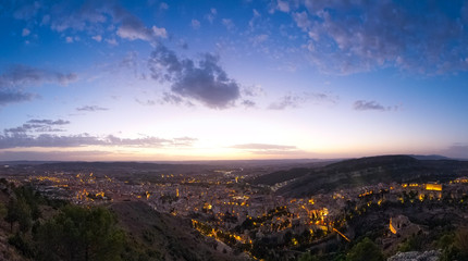 Fototapeta premium Wide panoramic view of the city of Cuenca from the observation deck Sacred Heart of Jesus - Cerro del Socorro. Sunset over the city.
