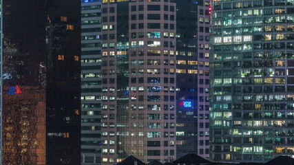 Aerial cityscape of Singapore downtown of modern architecture with skyscrapers night timelapse
