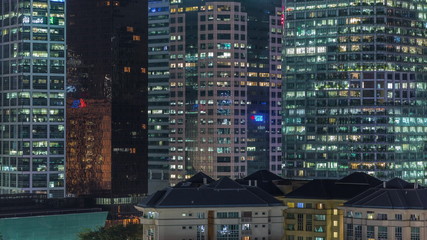 Fototapeta na wymiar Aerial cityscape of Singapore downtown of modern architecture with skyscrapers night timelapse