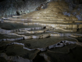 Stalactites that look like plates in a cave