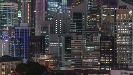 Aerial cityscape of Singapore downtown of modern architecture with skyscrapers night timelapse