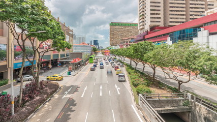 Fototapeta na wymiar Aerial view of traffic on Eu Tong Sen Street and new bridge road all the way to Chinatown timelapse