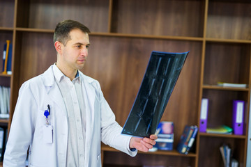 Doctor looking at x-ray in a hospital. Medical and health care concept.