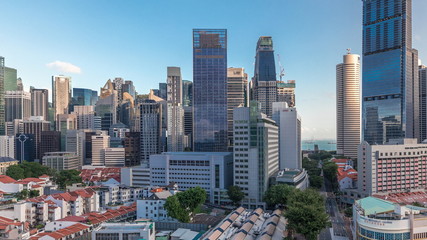 Aerial view of Chinatown with red roofs and Central Business District skyscrapers timelapse, Singapore
