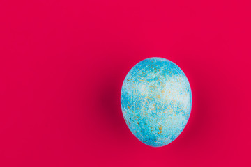 Easter egg painted blue with gold.