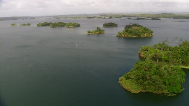 Aerial view of Lake Bayano, small islands with palms and cloud forest in Panama Central America, filmed with Cineflex stabilization 5-Axis camera system