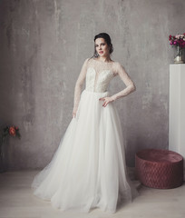 portrait beautiful bride in elegant wedding dress in studio