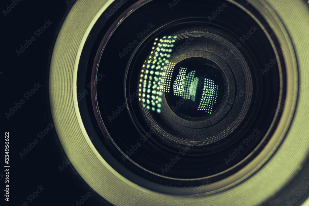 Poster beautiful camera lens with light reflection. background pattern for design. macro photography view..