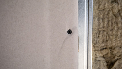 Interior repair, construction and renovation. Metal profiles and fasteners for plasterboard sheets, stone wool insulation