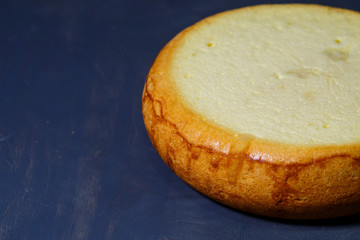 Freshly baked sponge cake with a golden brown crust.