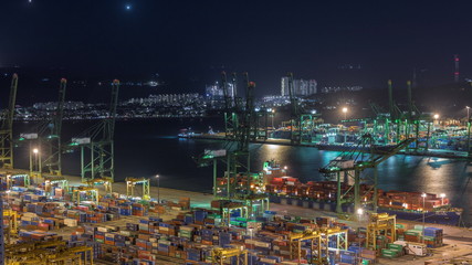 Fototapeta na wymiar Commercial port of Singapore aerial night timelapse.