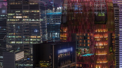 Aerial cityscape of Singapore downtown of modern architecture with skyscrapers night timelapse