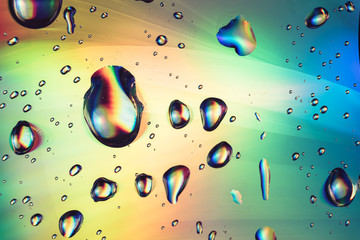 Close up beautiful abstraction multi colored water drop of holographic effect. Background pattern...