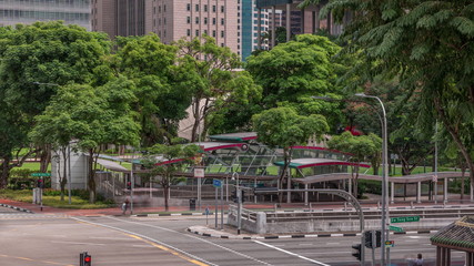 Traffic with cars on a street and urban scene in the central district of Singapore timelapse