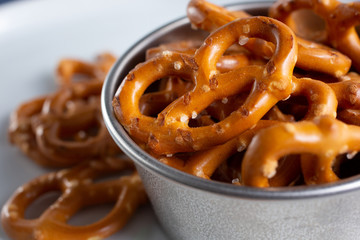 A macro closeup view of a pile of gluten free pretzels.
