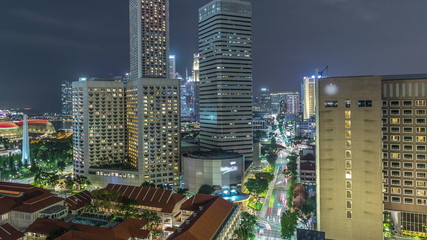 Night panorama with Marina Bay area and skyscrapers city skyline aerial timelapse.
