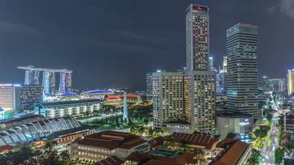 Night panorama with Marina Bay area and skyscrapers city skyline aerial timelapse.