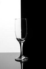 Glass champagne glass on a black and white background
