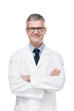 Confident male doctor or pharmacist in white lab