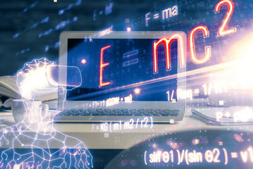Desktop computer background and formula hologram writing. Double exposure. Education concept.