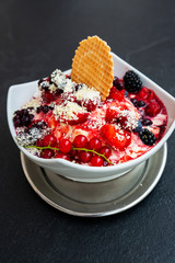 Red berries fruits with vanilla ice cream