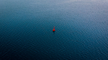 A buoy floating gently on the surface of the Adriatic sea