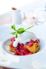 French toast grilled with strawberries and ice cream on top