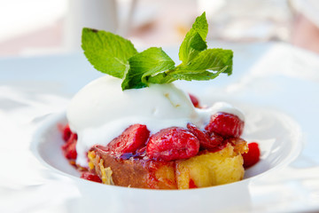 French toast grilled with strawberries and ice cream on top