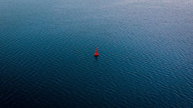 A buoy floating gently on the surface of the Adriatic sea