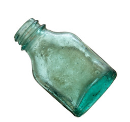 Very old green glass medicine bottle isolated on white. Looks hand blown.