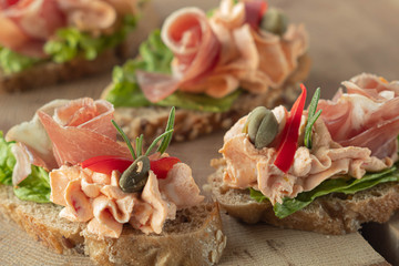 Apetizer bruschetta with smoked ham