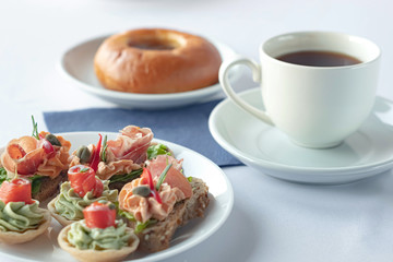 Meal canape with salted sockeye, bruschetta with smoked ham