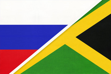 Russia vs Jamaica national flag from textile. Relationship and partnership between two countries.