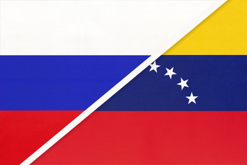 Russia vs Venezuela national flag from textile. Relationship and partnership between two countries.