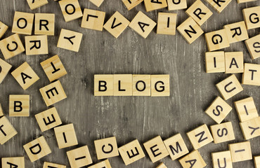 Blog word made of wooden blocks on a dark background