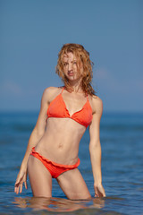Obraz premium Beautiful girl in bikini on the beach