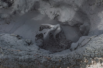 Beautiful colourful Icelandic landscape lava fields mountain geysers zigzag road and moss-covered stones Namafjall, Iceland.