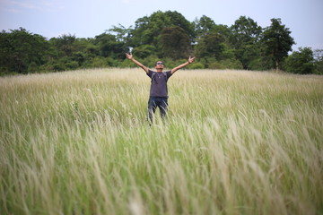 A man standing in grass color white, Thailand