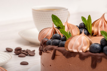 Chocolate poultry milk garnished with marshmallows and blueberries