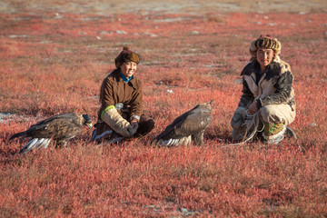 Traditional kazakh eagle hunters with their golden eagle that is used to hunt for fox and rabbit...