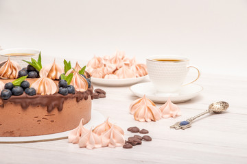 Chocolate poultry milk garnished with marshmallows and blueberries