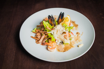 mix salad with seafood and parmesan