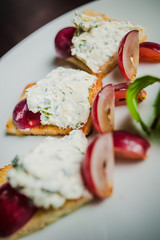 sandwich with soft cheese and grapes