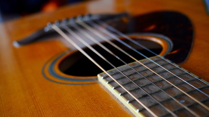 Fototapeta na wymiar Close up macro on guitar strings. Musical instrument concept idea. Music and sound