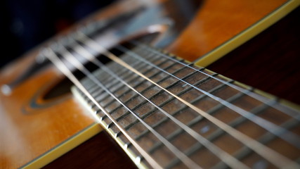 Close up macro on guitar strings. Musical instrument concept idea. Music and sound