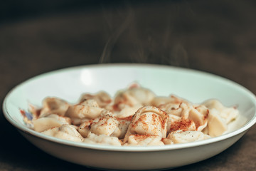 one plate of hot pilmen, seasoned with red and black pepper
