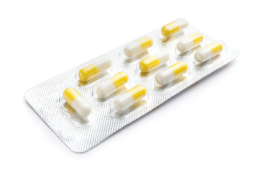 Blister pack with pills on white background