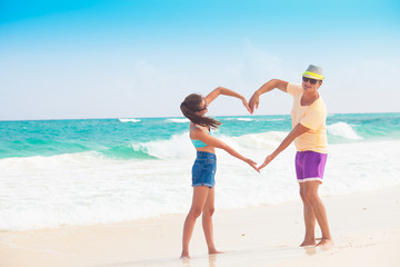 Beach couple walking on romantic travel honeymoon vacation summer holidays romance. Young happy lovers, Cayo Largo, Cuba